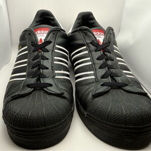Adidas superstar’s Black leather Sneakers with White Stripes